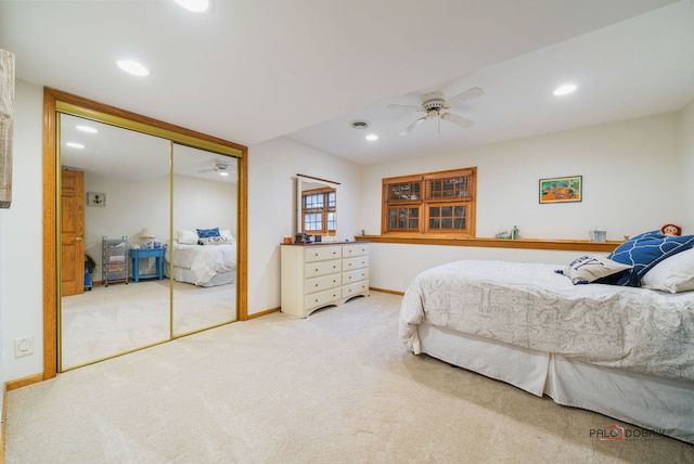 bedroom featuring a closet, ceiling fan, and carpet