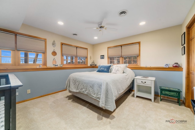 carpeted bedroom with ceiling fan