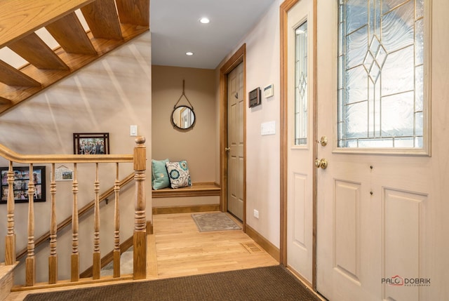 entryway with hardwood / wood-style flooring