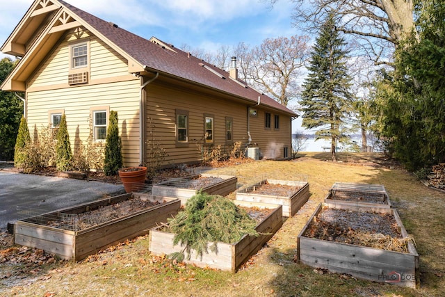 view of home's exterior featuring central air condition unit