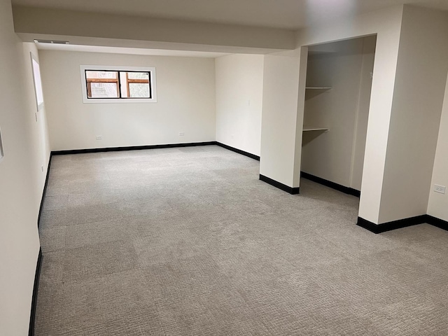 unfurnished bedroom featuring light carpet