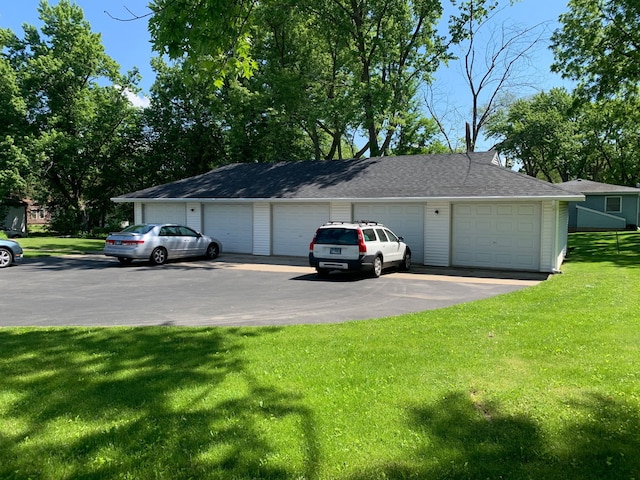 garage featuring a yard