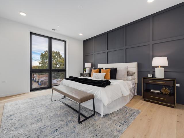 bedroom featuring light wood-type flooring