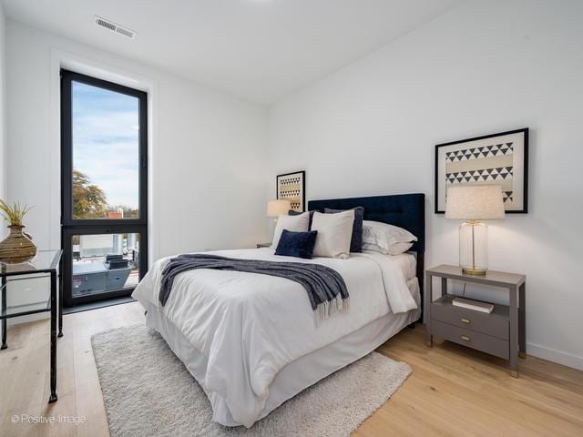 bedroom with light hardwood / wood-style flooring