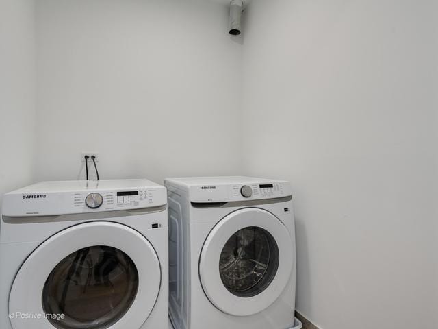 washroom featuring independent washer and dryer