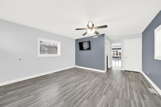 unfurnished living room with ceiling fan and light hardwood / wood-style floors