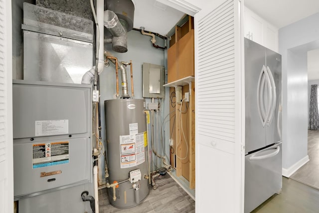 utility room featuring water heater