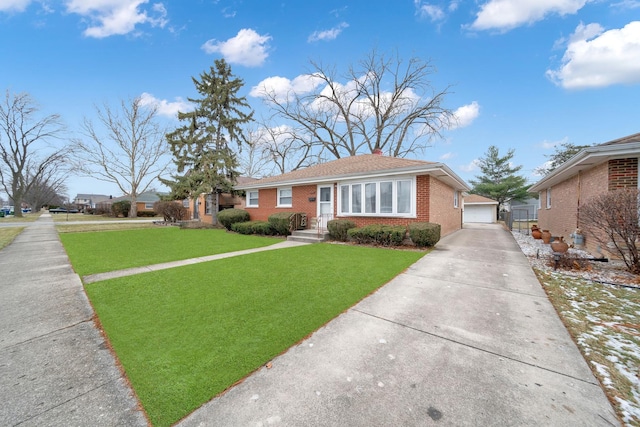 view of front of home with a garage, an outdoor structure, and a front lawn