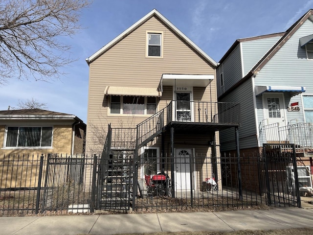 view of front of home featuring a balcony