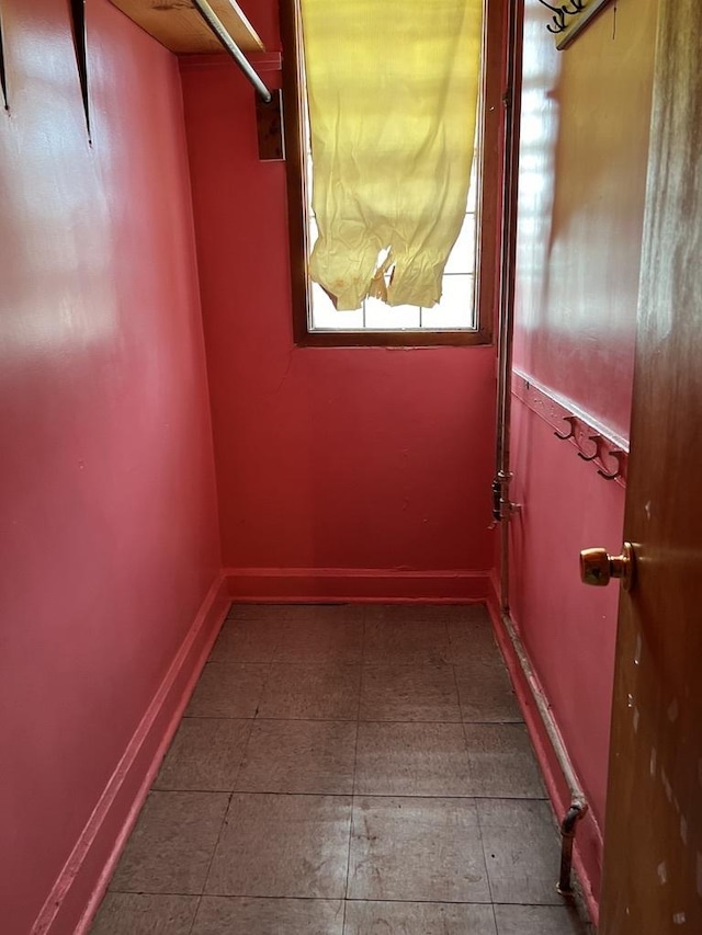 interior space featuring dark tile patterned flooring