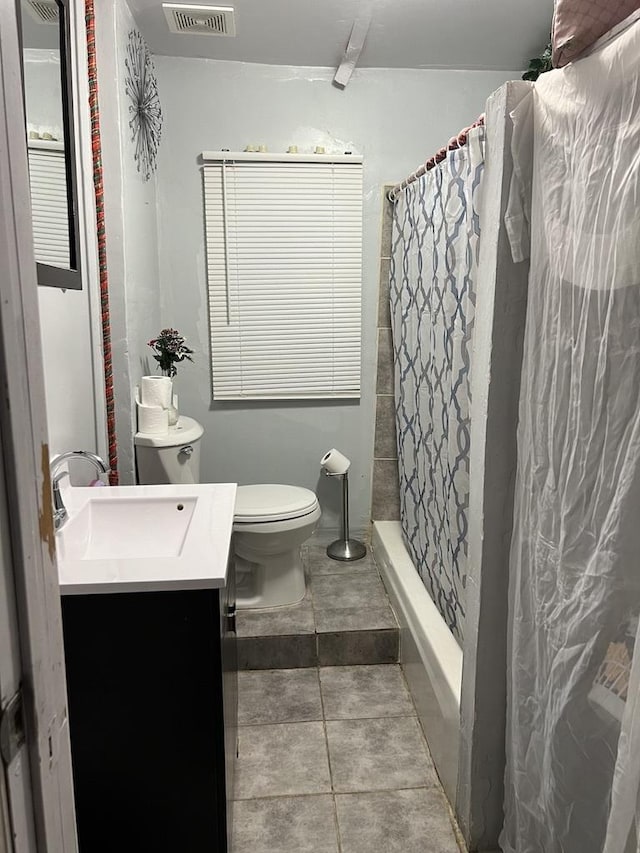 bathroom with vanity, a shower with curtain, tile patterned floors, and toilet