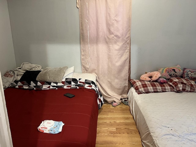 bedroom with light wood-type flooring