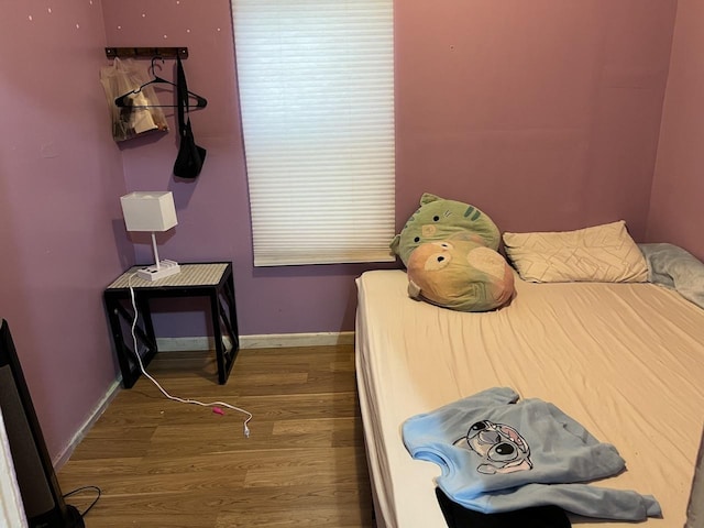 bedroom featuring hardwood / wood-style flooring