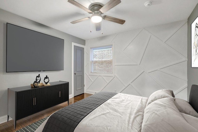 bedroom featuring dark wood-type flooring and ceiling fan