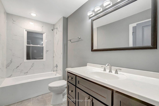 full bathroom with vanity, tiled shower / bath combo, and toilet