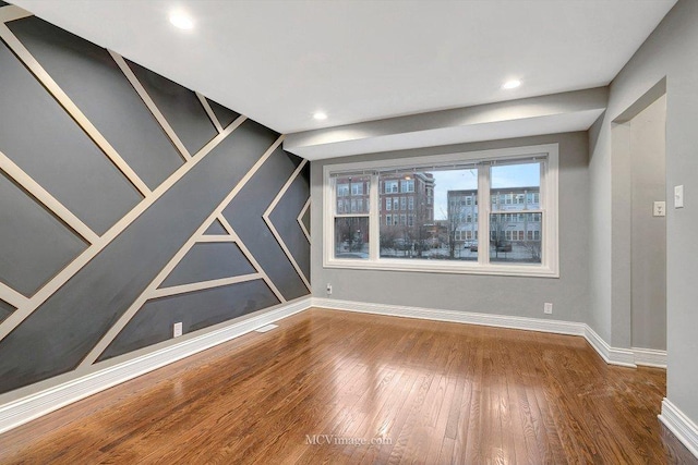 unfurnished room featuring hardwood / wood-style floors