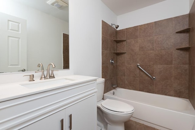 full bathroom with vanity, toilet, and tiled shower / bath