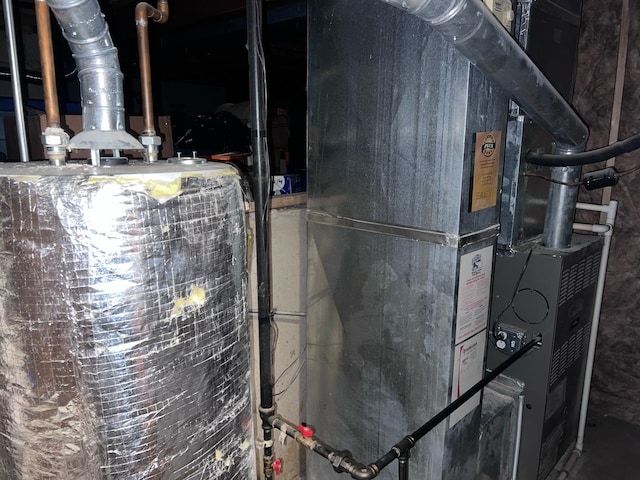 utility room featuring gas water heater