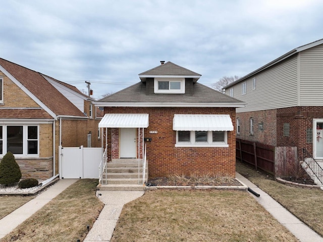 bungalow with a front yard