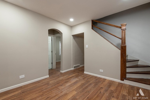 unfurnished room featuring hardwood / wood-style flooring