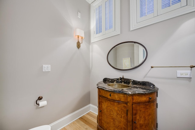 bathroom with vanity and hardwood / wood-style floors