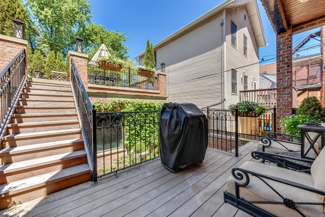 wooden deck featuring grilling area