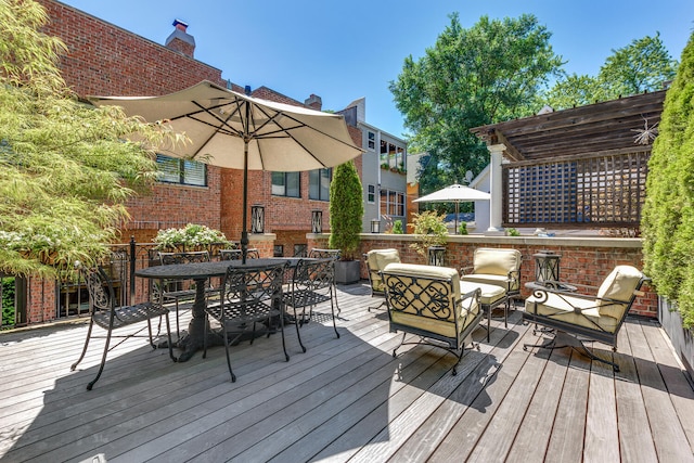 wooden terrace featuring an outdoor living space and a pergola