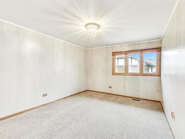 carpeted empty room with ornamental molding