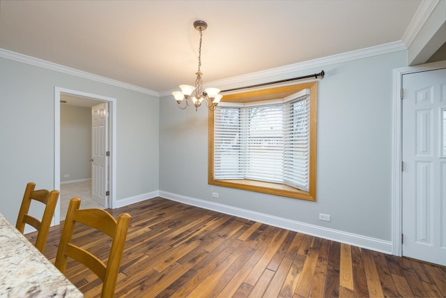 unfurnished dining area with crown molding, dark hardwood / wood-style flooring, and a chandelier