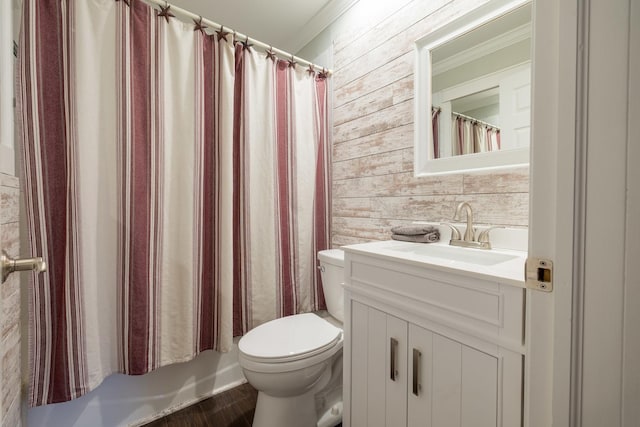 bathroom featuring vanity, hardwood / wood-style floors, crown molding, and toilet