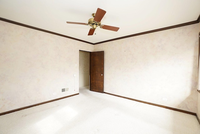 unfurnished dining area with visible vents, ornamental molding, a wainscoted wall, and an inviting chandelier