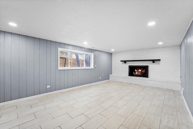 basement with a brick fireplace