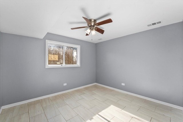 unfurnished room with ceiling fan