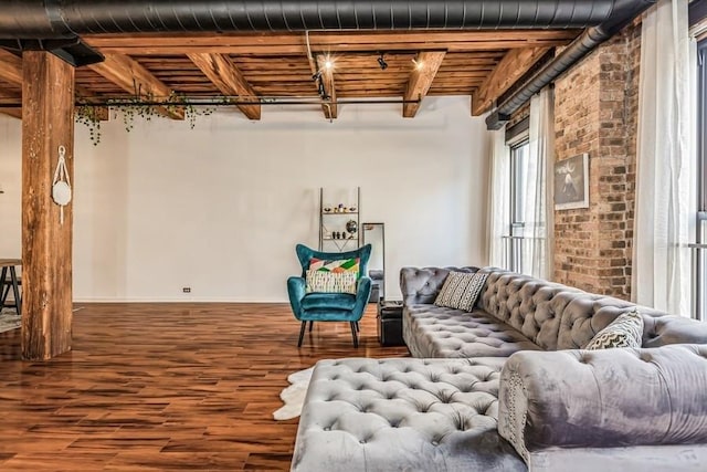 interior space with hardwood / wood-style flooring and beamed ceiling