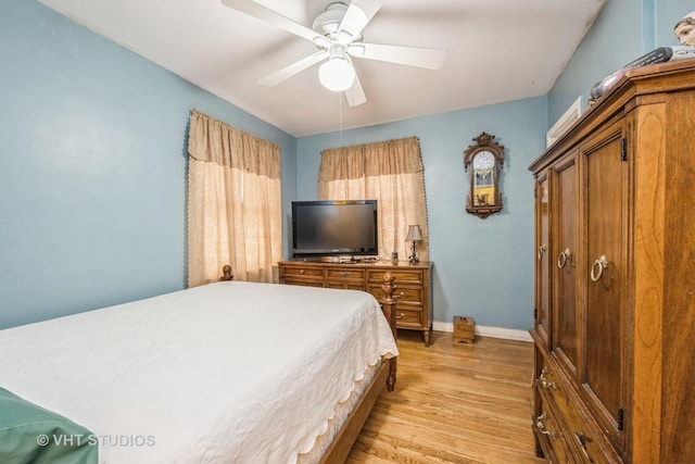 bedroom featuring ceiling fan and light hardwood / wood-style flooring