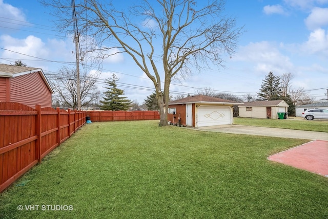 view of yard featuring an outbuilding and a garage