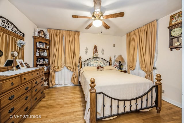 bedroom featuring ceiling fan and light wood-type flooring