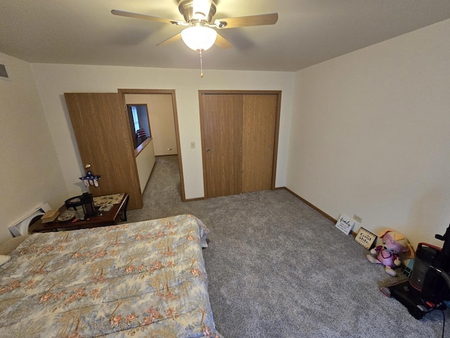 carpeted bedroom with ceiling fan and a closet