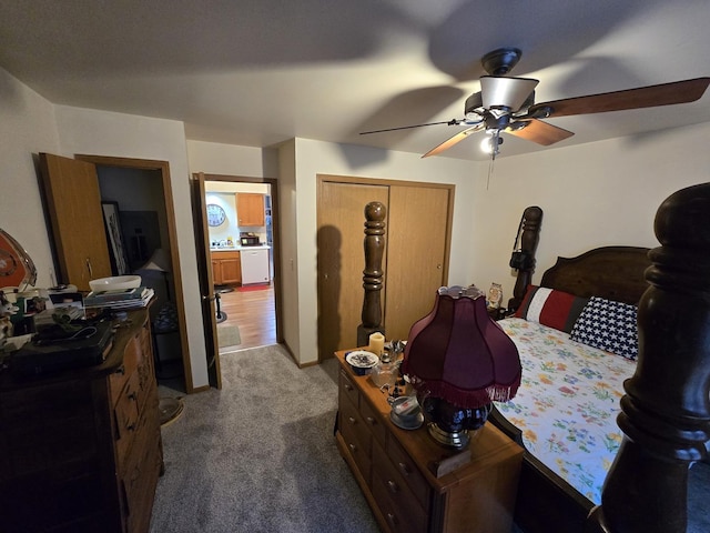 carpeted bedroom with ceiling fan and a closet