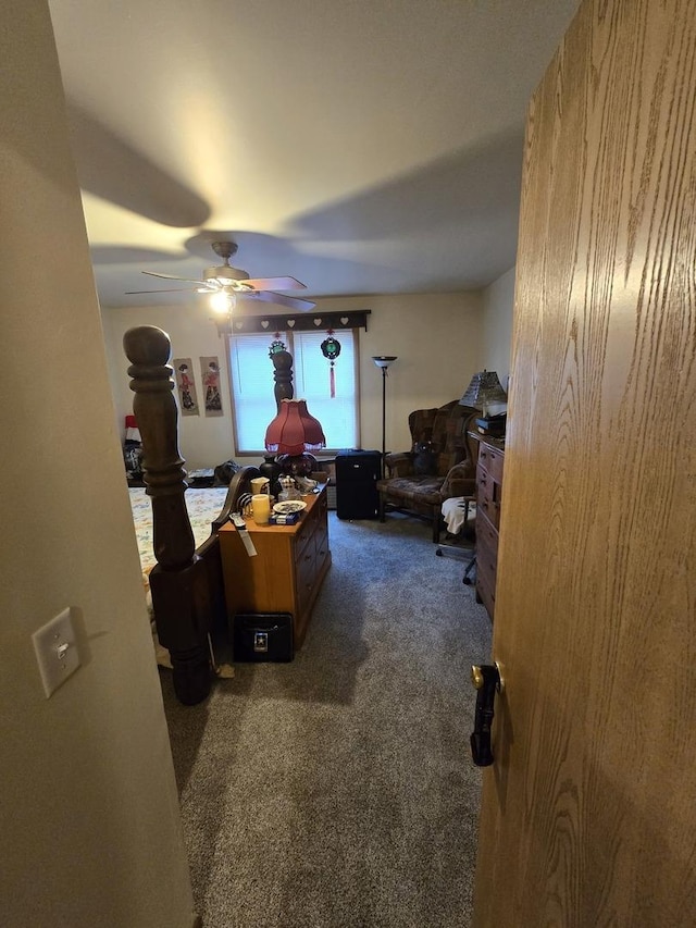 home office featuring ceiling fan and dark carpet