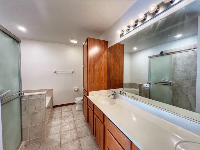 full bathroom with vanity, tile patterned floors, independent shower and bath, and toilet