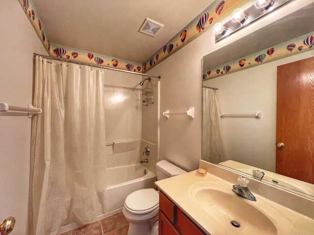 full bathroom with vanity, shower / tub combo, and toilet