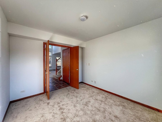 spare room featuring carpet flooring