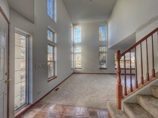 view of carpeted foyer