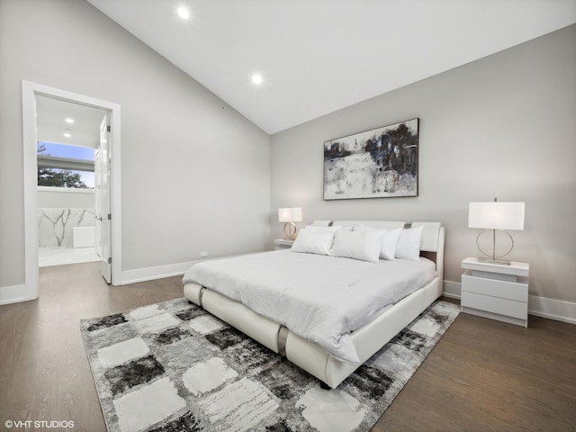 bedroom featuring ensuite bath, lofted ceiling, and dark hardwood / wood-style floors