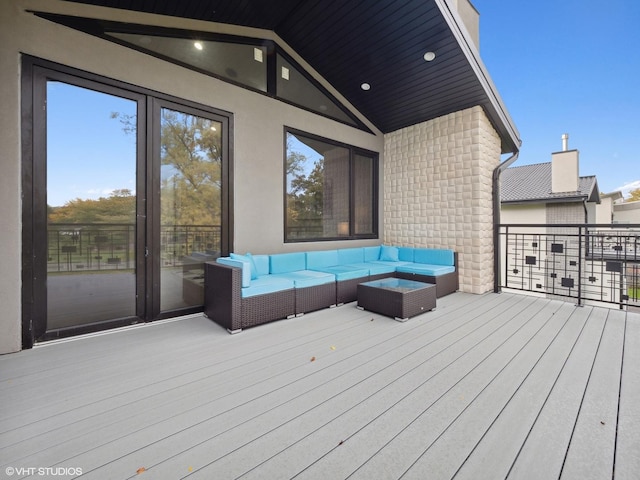 wooden terrace featuring an outdoor hangout area