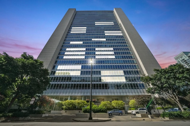 view of outdoor building at dusk