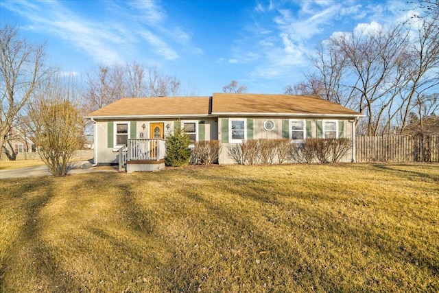 ranch-style home featuring a front yard