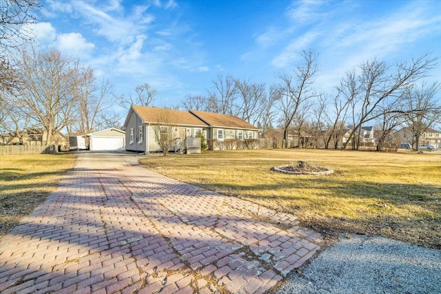 view of front of property with a garage and a front yard