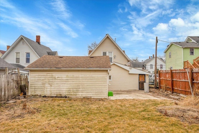 back of property featuring a yard and a patio area